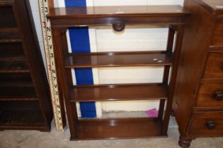 A reproduction open front wall shelf by Reprodux