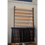 A pair of black painted pine bed frames