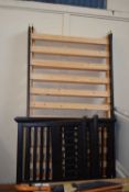A pair of black painted pine bed frames