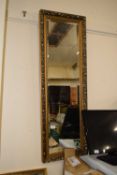 Modern rectangular bevelled wall mirror in gilt effect frame