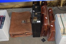 A group of four various leather cases