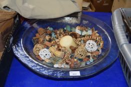 A large glass bowl filled with pot pourri