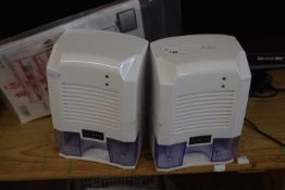 A pair of USB de-humidifiers