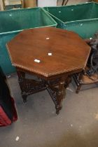 A late Victorian American walnut octagonal centre table