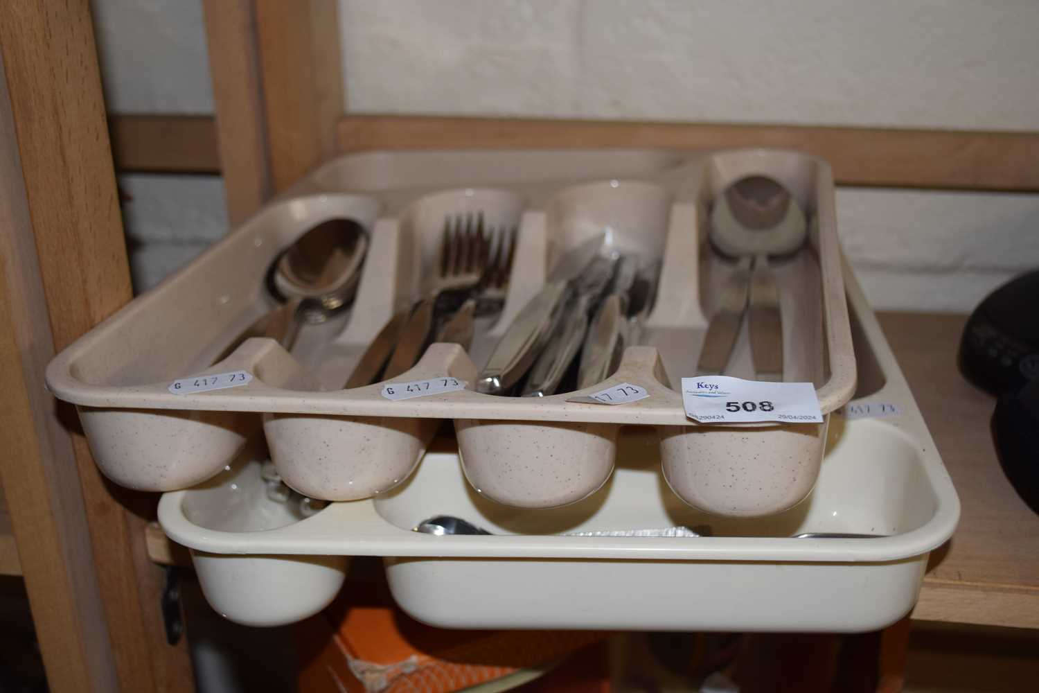 Two trays of steel cutlery
