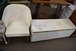A Lloyd Loom style chair and a matching ottoman containing various household sundries NOTE: not