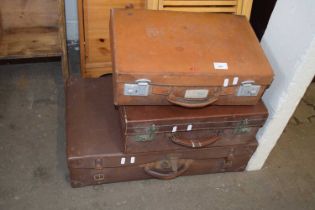 Three assorted suitcases