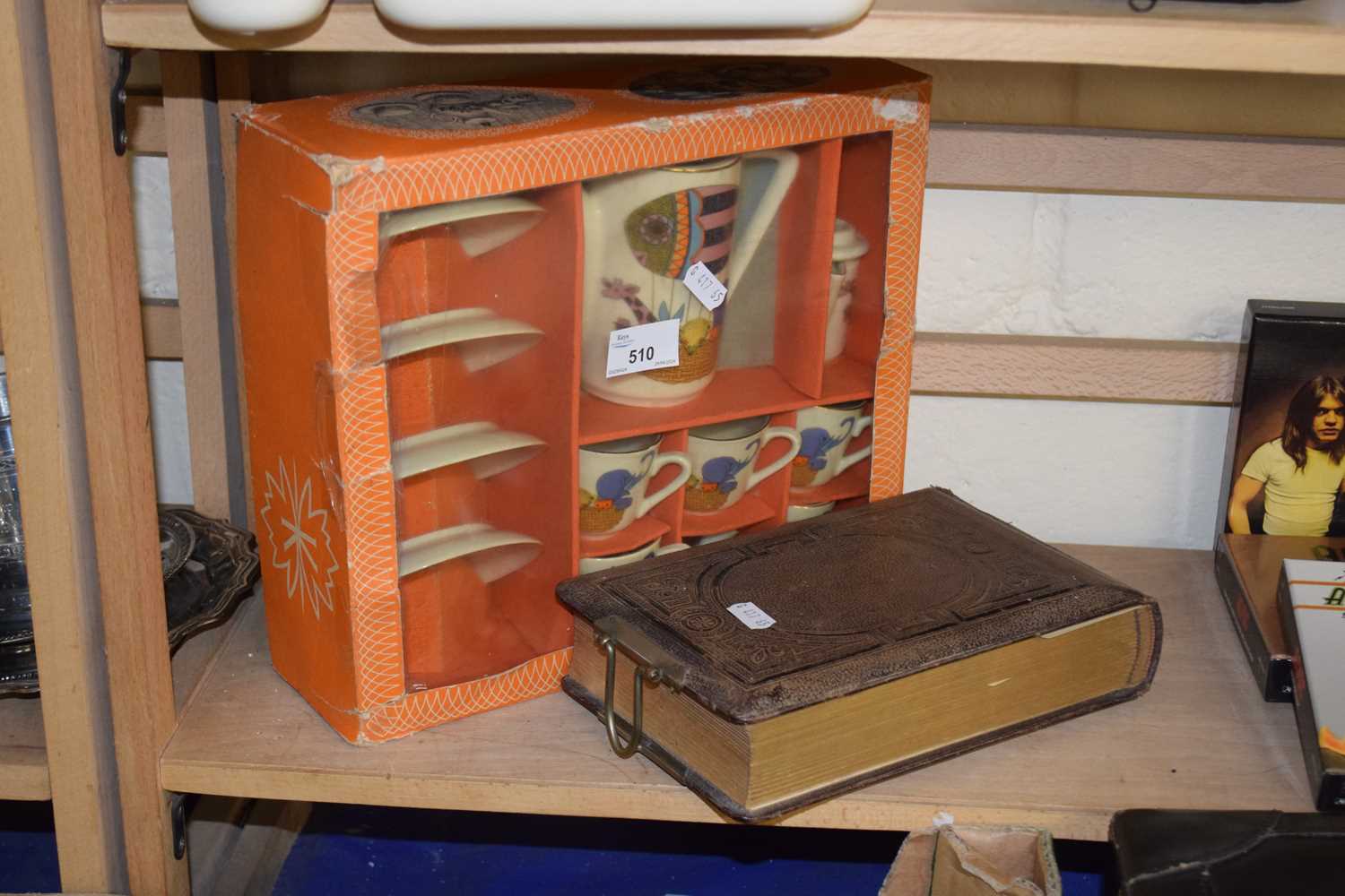 A boxed child's tea set together with a Victorian photograph album (empty)