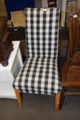 Dining chair with loose chequered cover