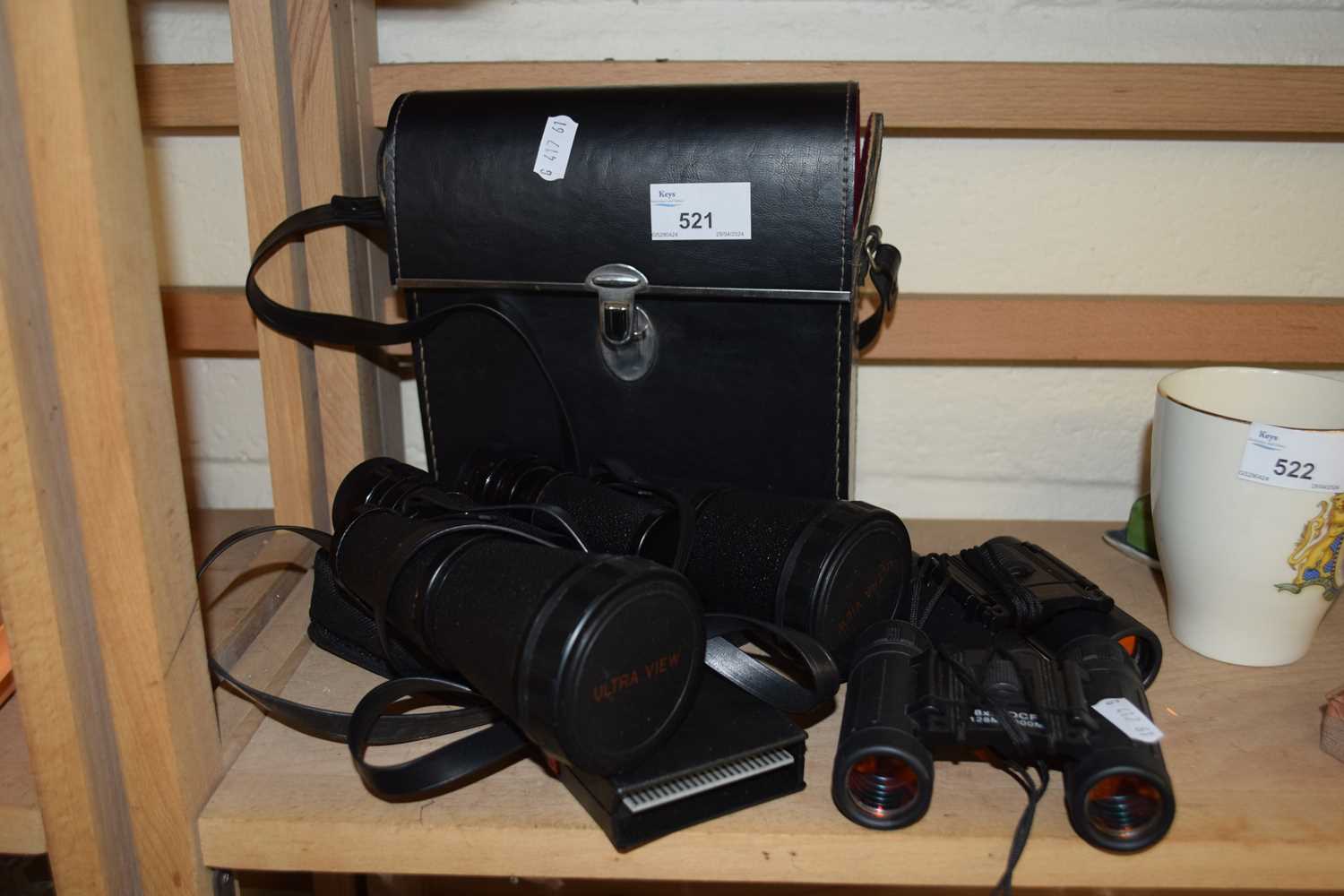 A pair of Ultraview 20 x 50 binoculars plus further pairs of travel binoculars