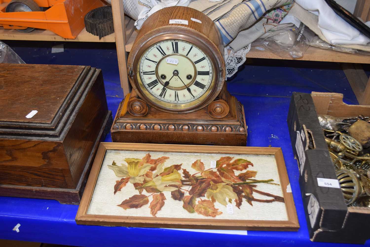 A German oak cased mantel clock together with a painted on glass floral study