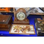 A German oak cased mantel clock together with a painted on glass floral study