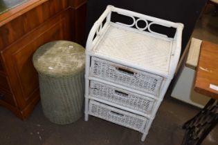 A bamboo framed three drawer chest and a further laundry basket