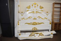 A large modern cream and gilt painted half tester bed frame