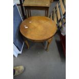 A walnut veneered circular coffee table