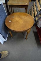 A walnut veneered circular coffee table