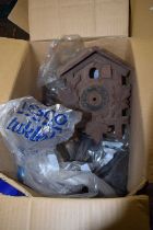 A box of various assorted clock parts