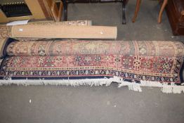 A modern floor rug with geometric design on a red and blue background