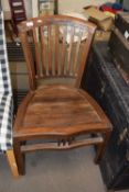 A hardwood chair with slatted seat