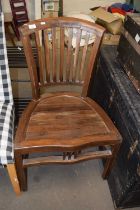 A hardwood chair with slatted seat