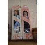 Two boxed porcelain dolls