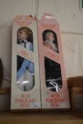 Two boxed porcelain dolls