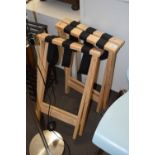 A pair of folding luggage stands