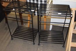 A pair of metal two tier stands or boot racks