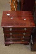Small mahogany veneered four drawer chest