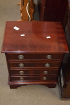 Small mahogany veneered four drawer chest