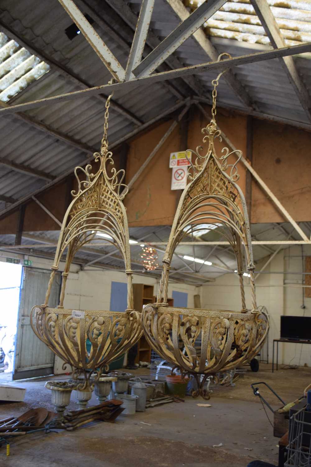 A pair of decorative iron plant hangers