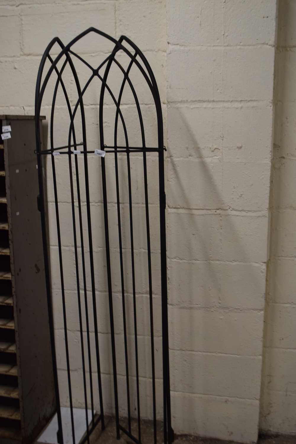 An iron framed three panel screen, height approx 190cm