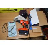 A Black & Decker cordless drill together with a 240v angle grinder