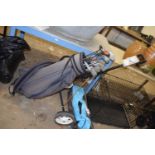 Golf bag with clubs and trolley