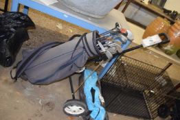 Golf bag with clubs and trolley