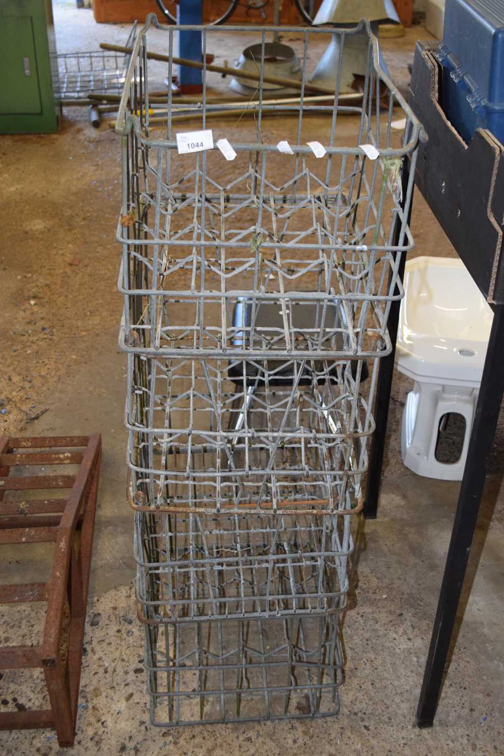 Four galvanised milk crates