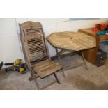 Wooden garden table together with four hardwood garden chairs