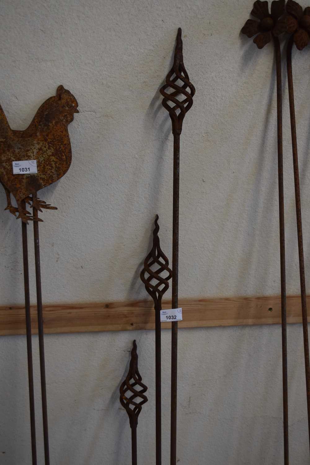 Group of three decorative iron spheres on stems