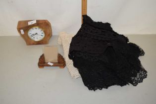 A quartz clock in wooden frame, also a wooden photo frame together with various linen