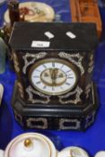 A Victorian wooden mantel clock with inlaid mother of pearl decoration