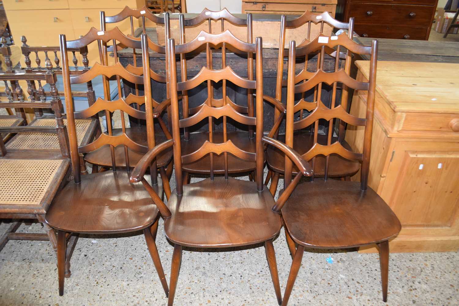 A matching set of six (four plus two) Ercol ladder back dining chairs