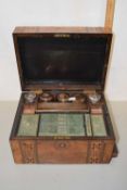 A walnut Victorian vanity case with a number of bottles together with a mirror