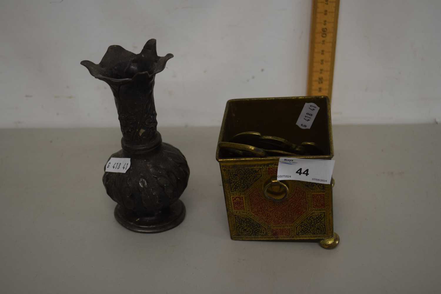 A small metal box with quantity of horse brasses together with a further plated vase