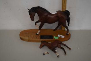 A Beswick model of horse and foal entitled Spirit of Affection on oval wooden plinth