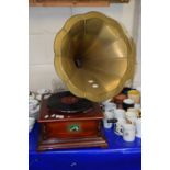 An old style gramophone player with metal horn