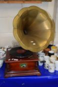 An old style gramophone player with metal horn