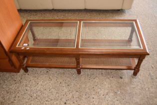 A glass topped coffee table