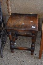 A small square occasional table