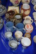 A group of pottery commemorative wares and mugs including a loving cup from Pilkingtons Tiles,