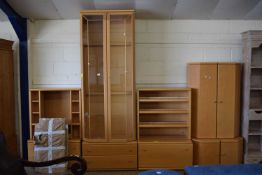 A good quality modern lounge suite comprising a tall display cabinet with two shelves and two side